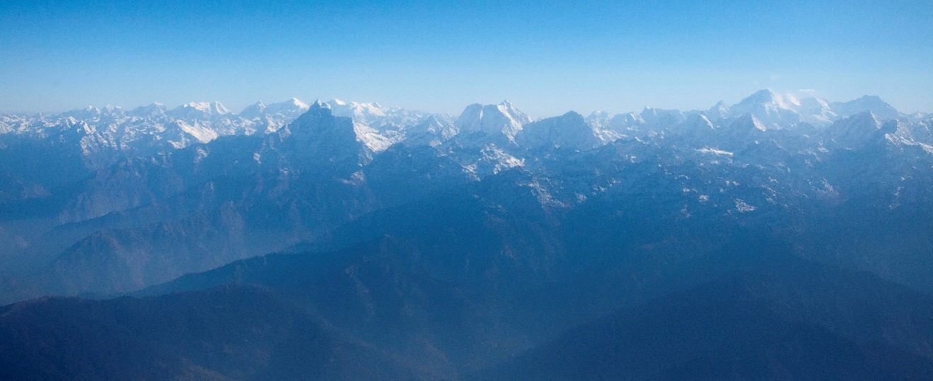 a view of the himalayas from an airplane window