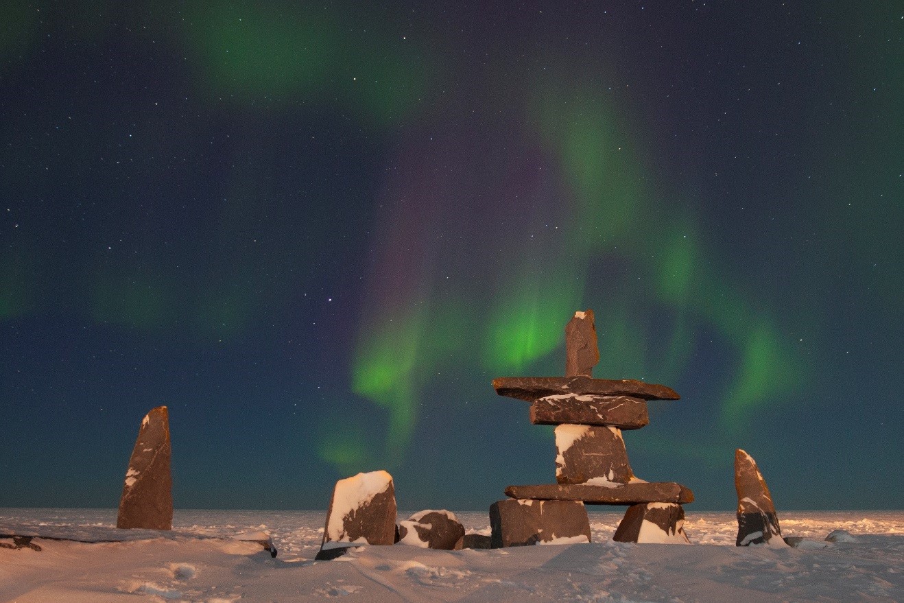 green and red aurora dances over the hudson bay in Churchill, Canada