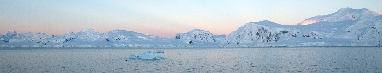 a panoramic photo of snowy mountains in antarctica