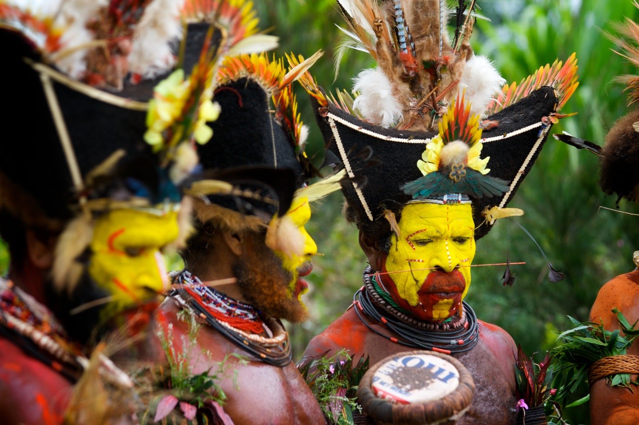 three huli warriors assemble for a sing sing in papua new guinea