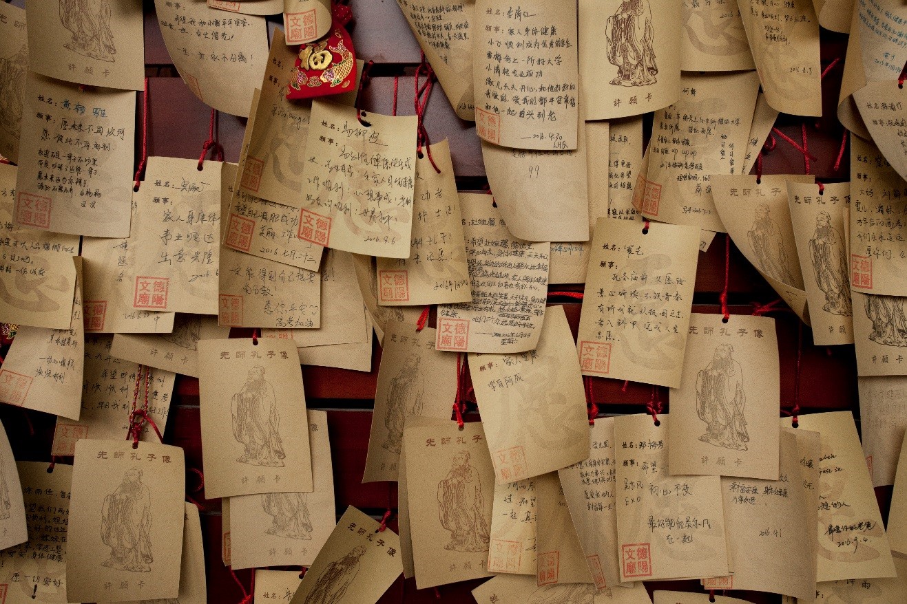 Buddhist scrolls are tacked outside of a monastery in rural china