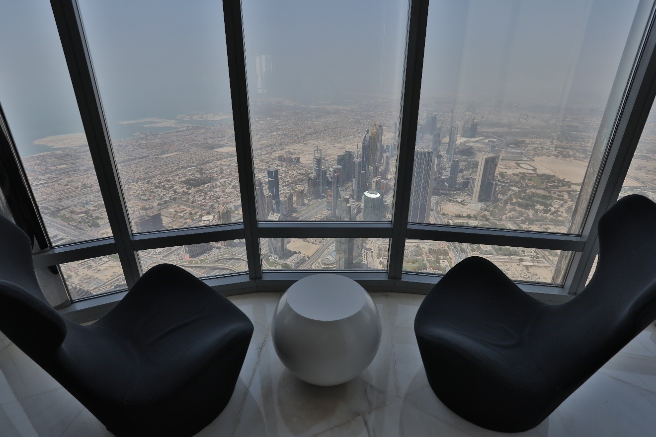 a view from inside the burj khalifa with chairs looking out