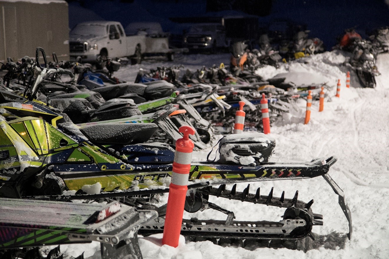 a parking area for snow mobiles is an interesting scene in cooke city