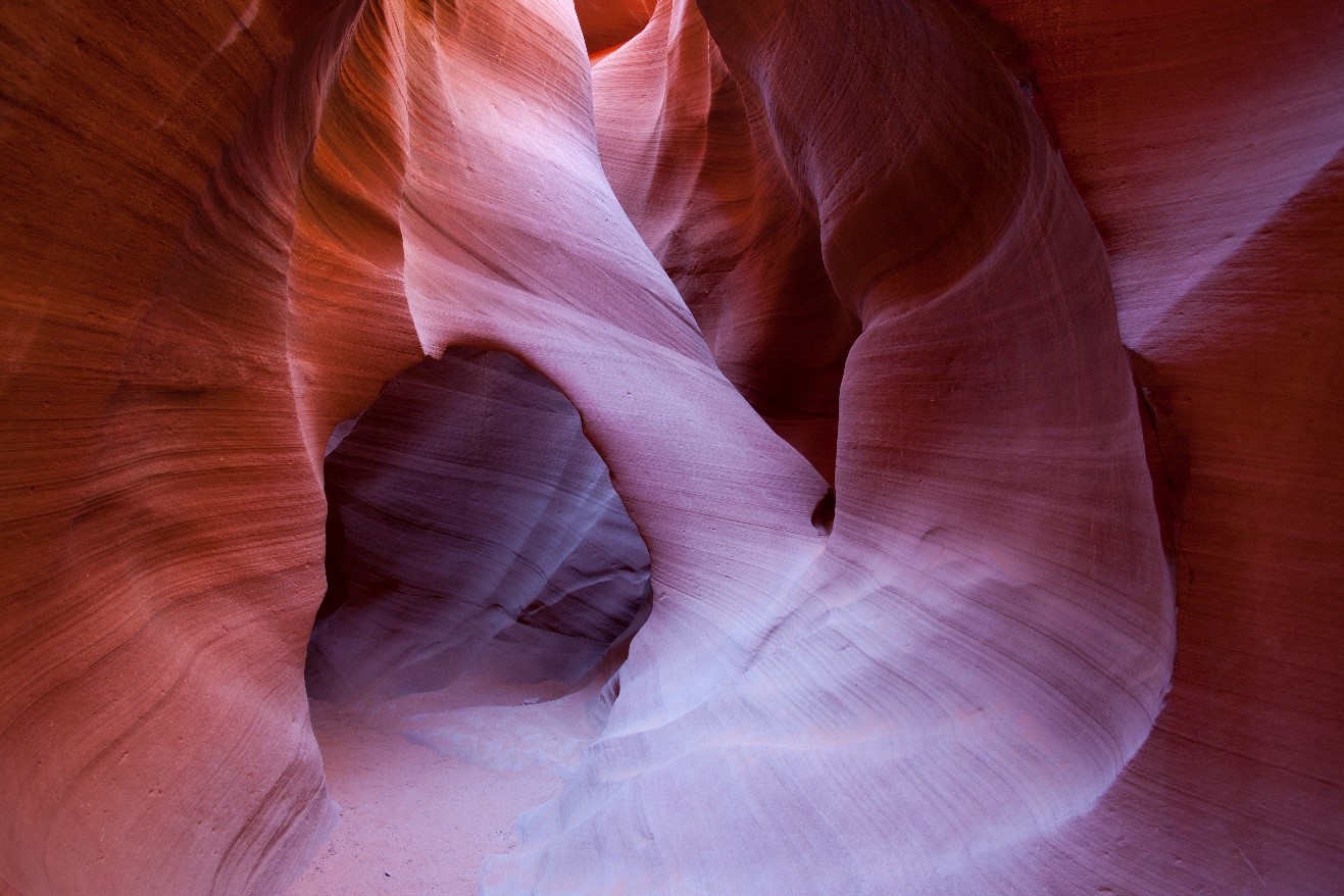 a slot canyon is revealed with stunning colors in the desert southwest of the USA