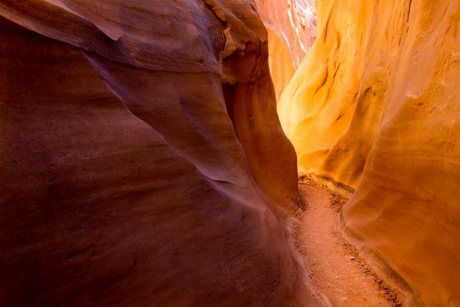 amazing light presents itself around the corner of a slot canyon in Escalante National Monument