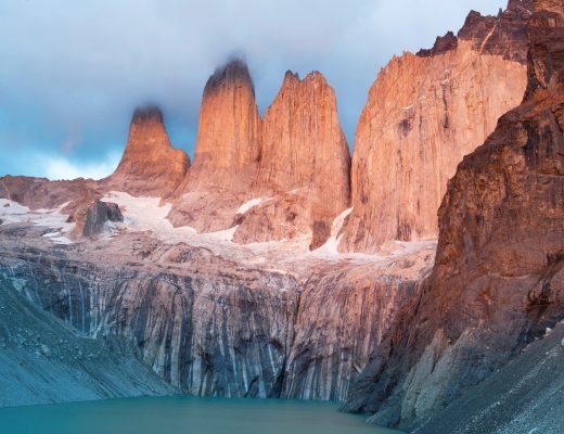 a stunning photo of peaks in patagonia with beautiful light