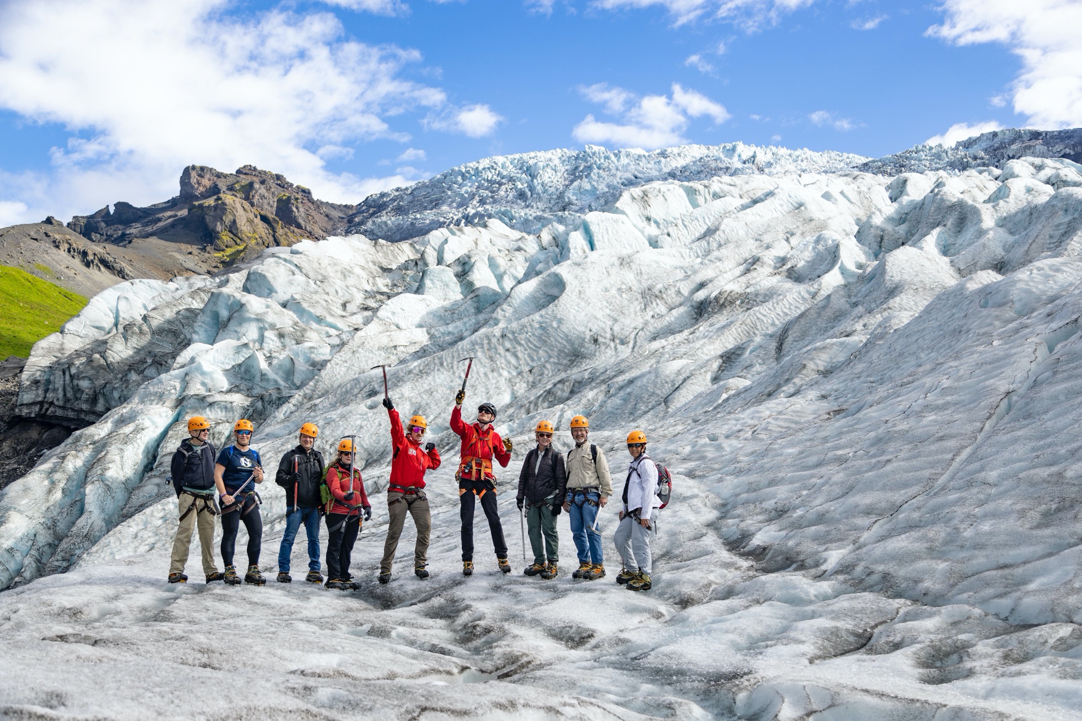 glacier trekkers cheering at camera