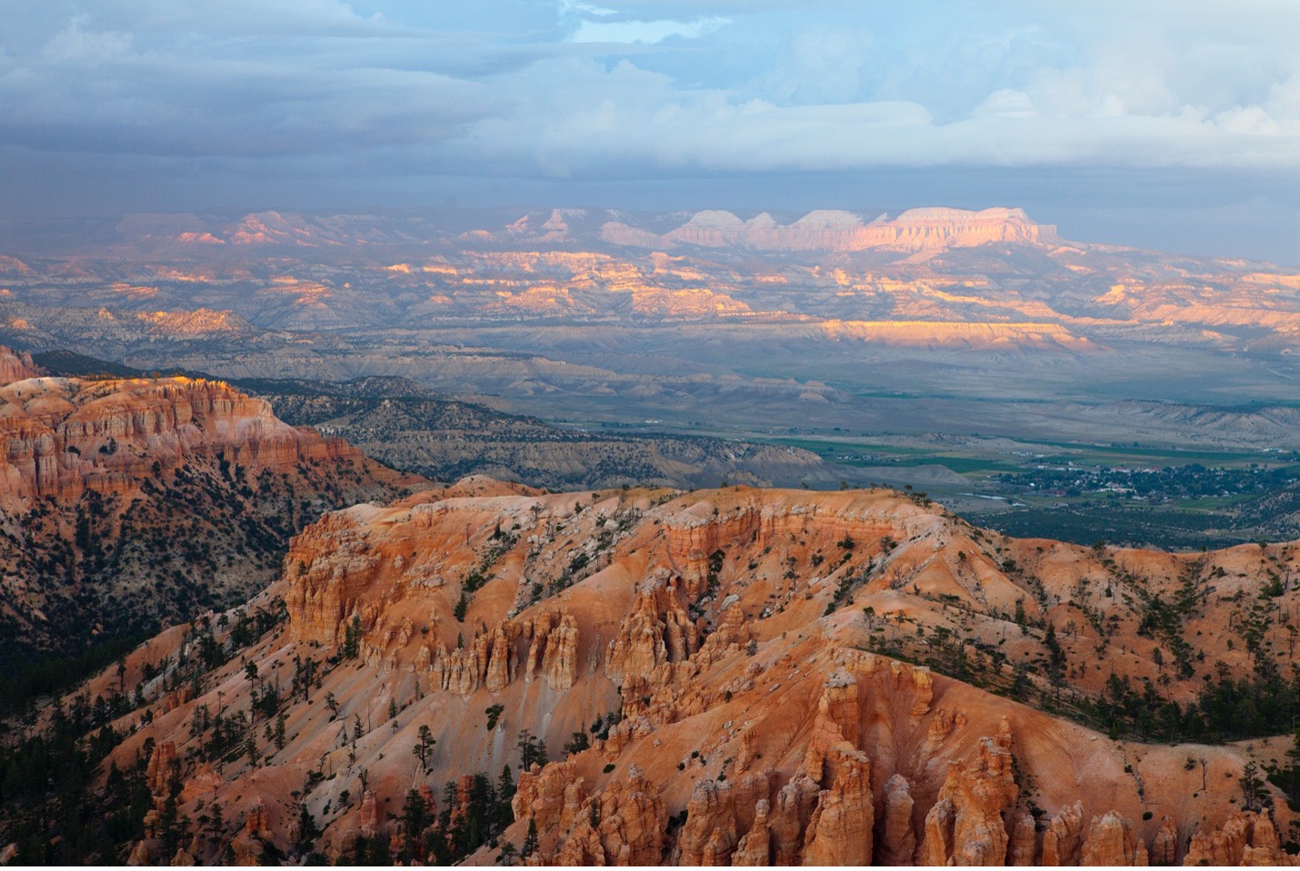 a dusk photo of bryce canyon with soft colorful lighting