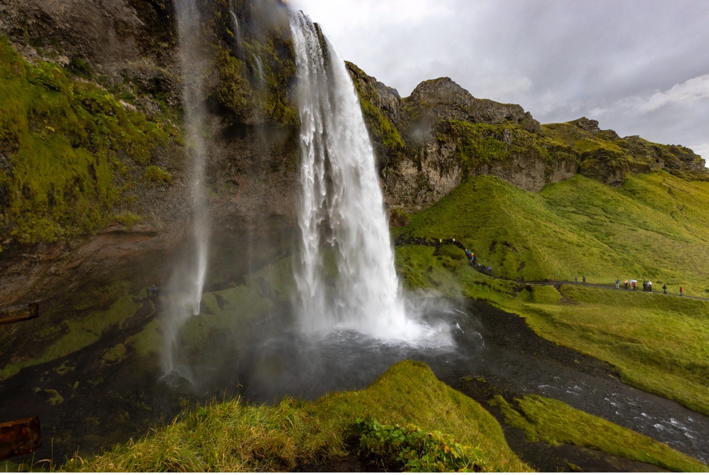 a wide angle view of a waterfall in iceland