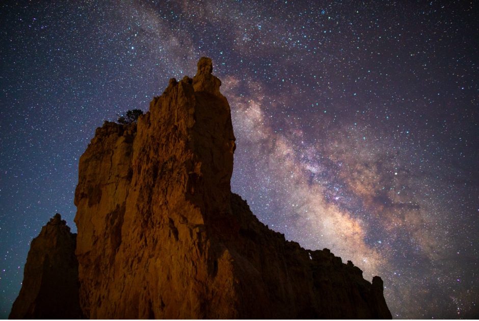 a night photo of bryce canyon national park with milky way in the sky