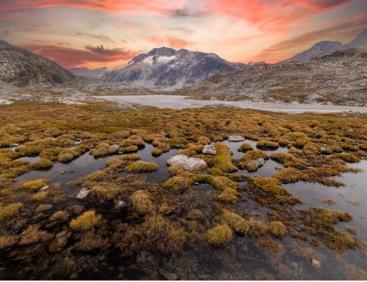 a beautiful sunset over a valley in Greenland